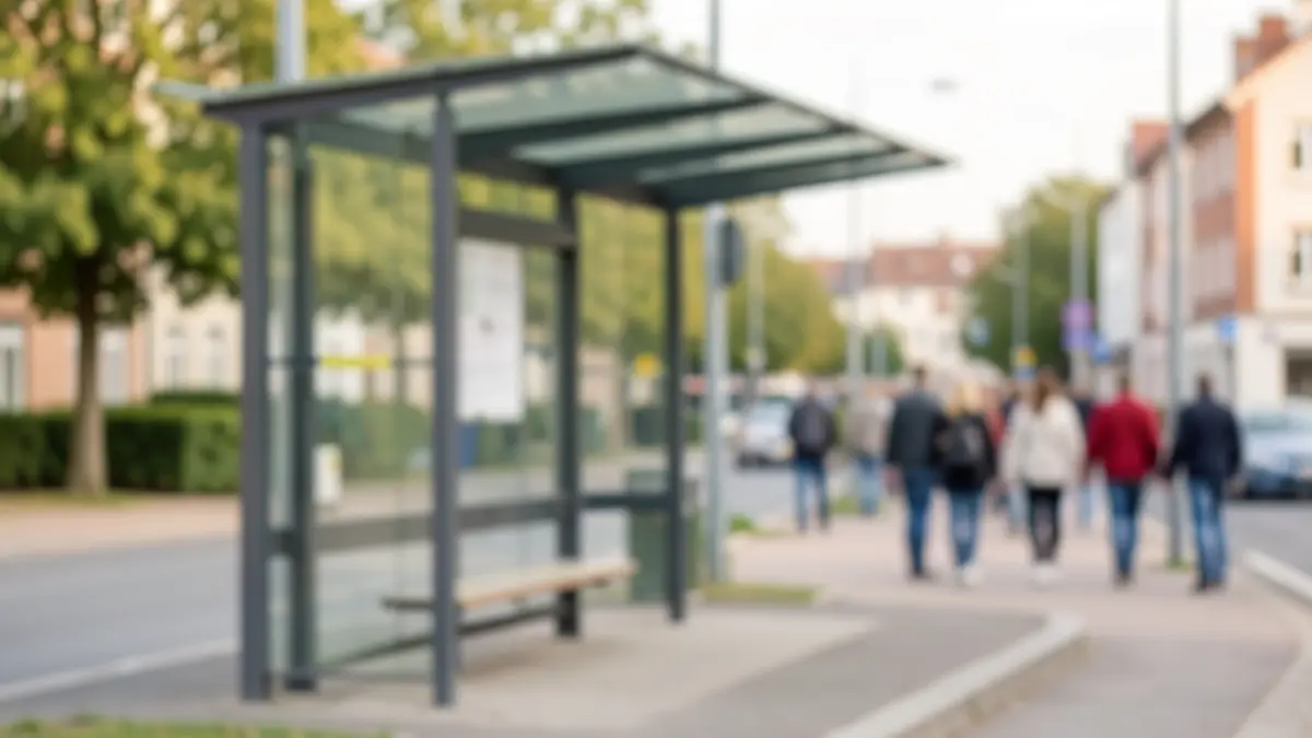 Generic image of a bus stop shelter in an urban environment, with no people or specific details.
